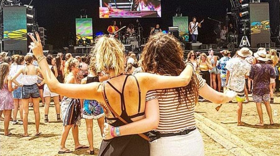 two girls watching a concert